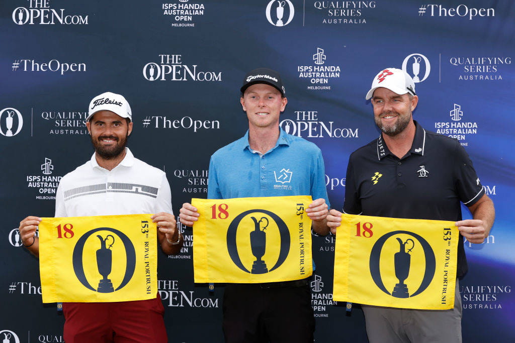 (l-r) Curtis Luck, Ryggs Johnston and Marc Leishman hold pin flags after qualifying for The 153rd Open
